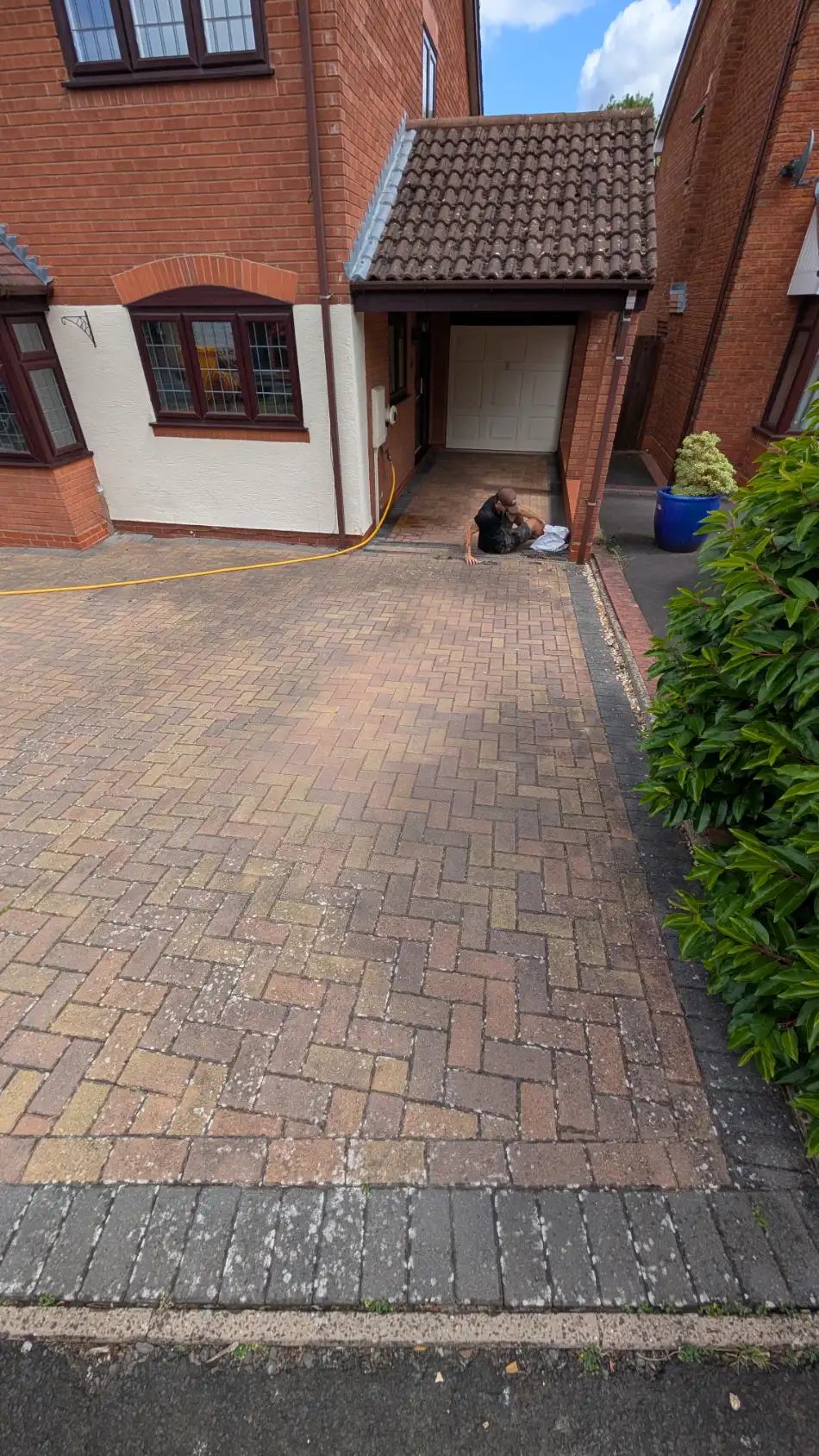Block-paved driveway in Preston before restoration cleaning