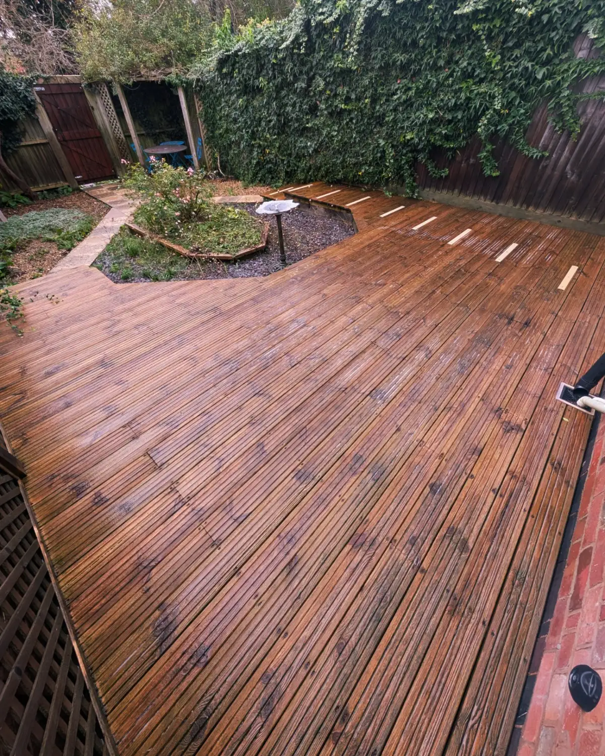 Same garden decking and path after exterior cleaning