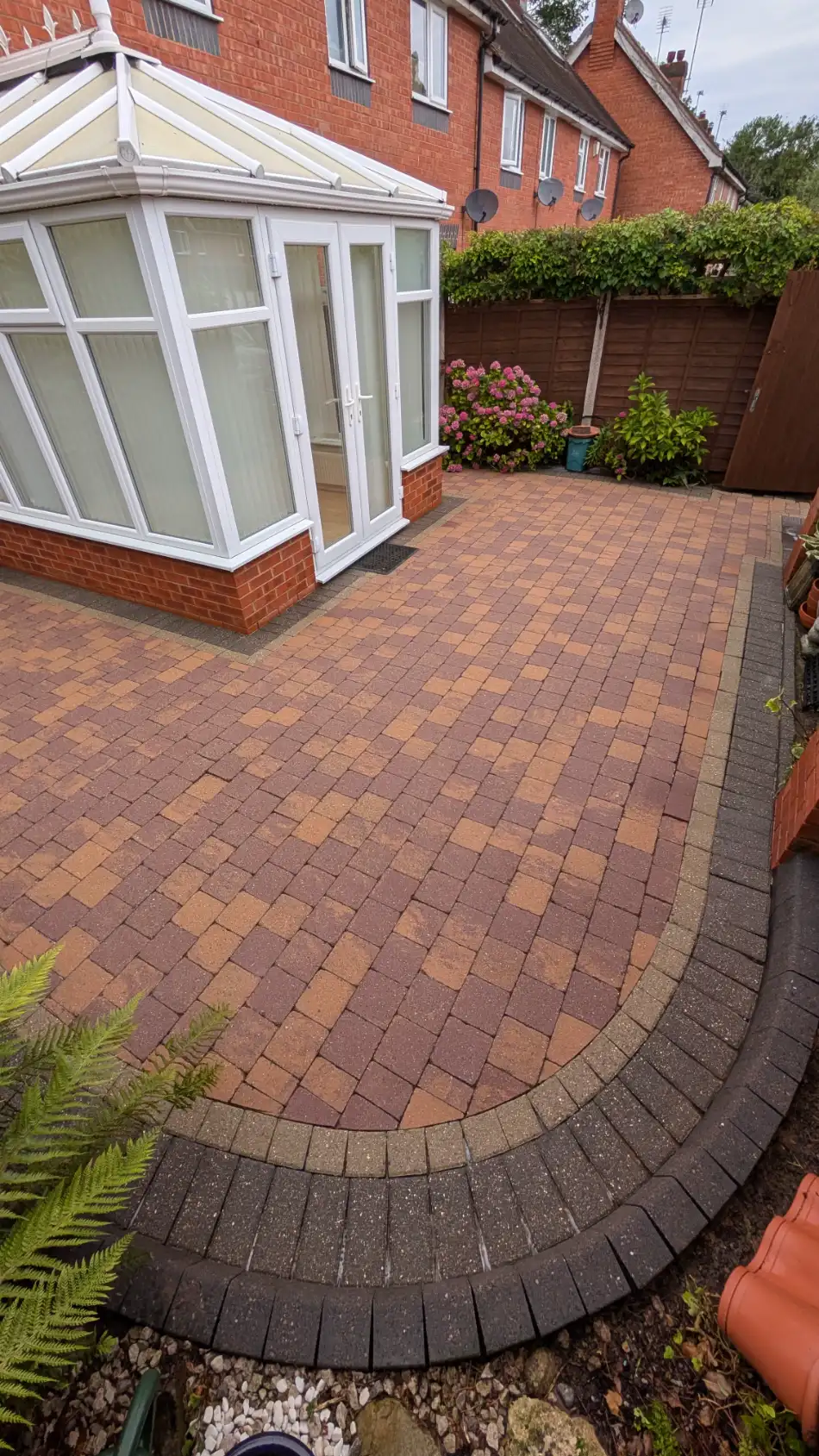 Same block-paved patio and path after pressure washing